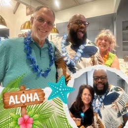 a group of people at a Hawaiian party